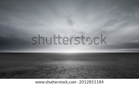 Dark Concrete Floor Background and Dramatic Gray Sky Clouds Horizon Royalty-Free Stock Photo #2012851184