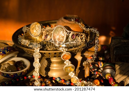 Still life with Jewelry old silvers in old brass tray,Concept of old treasures Royalty-Free Stock Photo #201287474