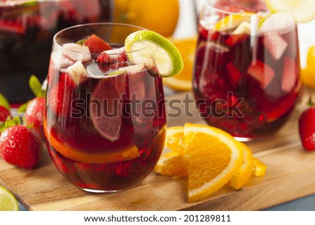 Homemade Delicious Red Sangria with Limes Oranges and Apples Royalty-Free Stock Photo #201289811