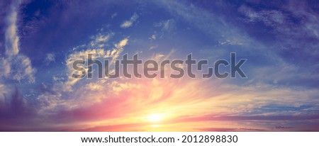 Panorama of colorful cloudy sky at sunset. Sky texture, abstract nature background