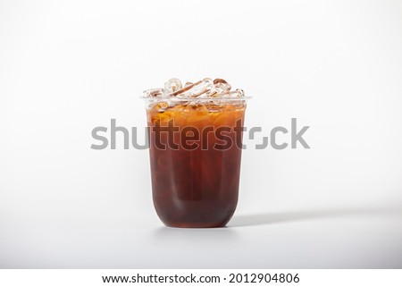 an iced coffee in a recycle plastic glass isolated white background