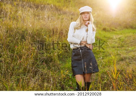 outdoors portrait of beautiful young woman wearing fashion autumn clothes on the nature  background of good autumn day