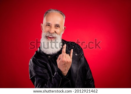 Photo of aged handsome man happy positive smile show rock sign music lover brutal isolated over red color background