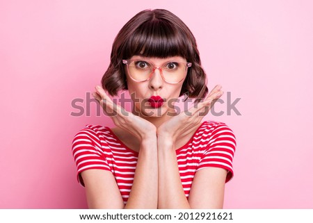 Photo portrait girl in spectacles pouted lips hands near face isolated pastel pink color background