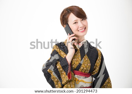 attractive asian woman wearing traditional Japanese kimono