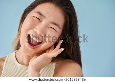 Woman shouting and making funny faces during photoshoot