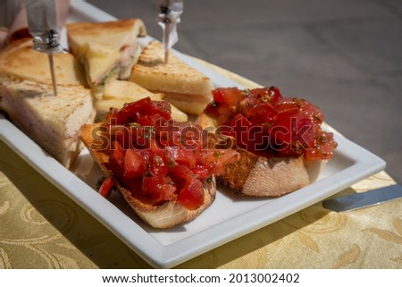on a plate there are bruschetta breads