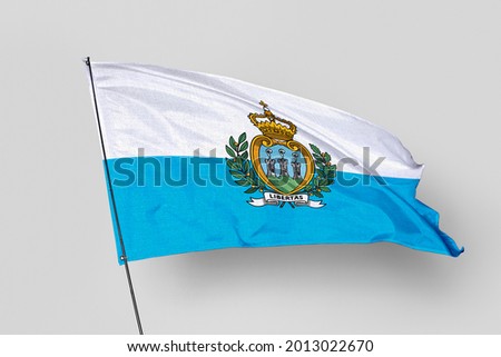 San Marino flag isolated on white background. National symbol of San Marino. Close up waving flag with clipping path.