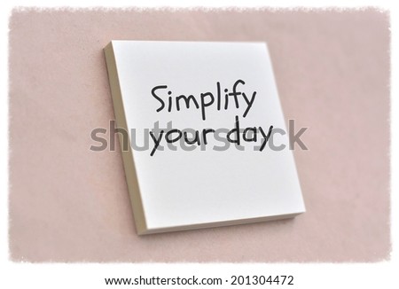 Text simplify your day on the short note texture background
