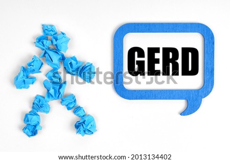 Medicine and health concept. On a white background, a blue man and a sign with the inscription - GERD