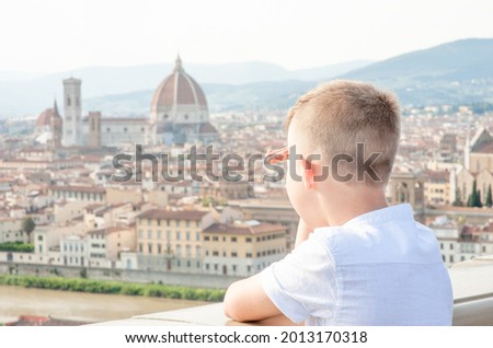 Young boy looking on panoramic view of Florence, Italy