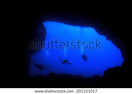 Into Darkness: Underwater cave scuba diving silhouettes