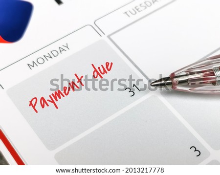 Reminder concept of payment. Close up text payment due written on calendar with a pen. Selective focus. Royalty-Free Stock Photo #2013217778