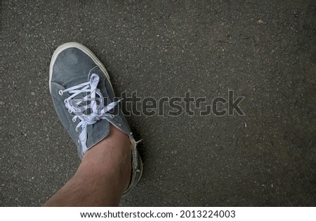 Rubbed old sneakers on long walks