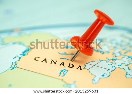 Location Canada, map with red push pin pointing close up, North America Royalty-Free Stock Photo #2013259631