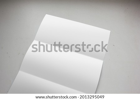 Blank tri-fold brochure on dusty texture white background for advertising business letter branding mockup.