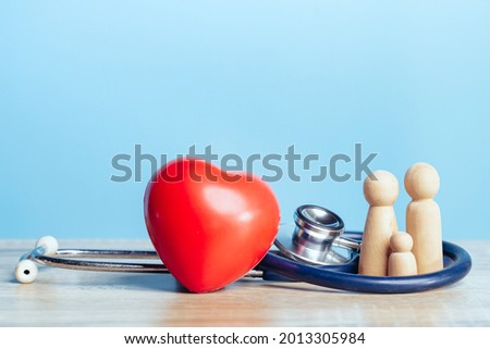 Family with stethoscope and a red heart. Concepts of a physical examination and Insurance family health live concept.