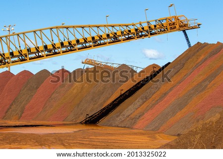 stock piles of iron ore at port. Royalty-Free Stock Photo #2013325022