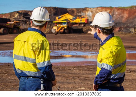 workers discussing on going job Royalty-Free Stock Photo #2013337805