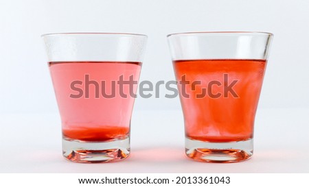 Diffusion of colors in a glass filled with hot water and another glass filled with cold water. The science of diffusion