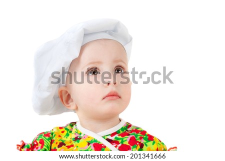 cute sweet little baby in the cook cap and with the big ladle