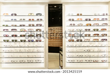 Showcase with stylish glasses. Health care, fashion and beauty. Front view. Royalty-Free Stock Photo #2013425159