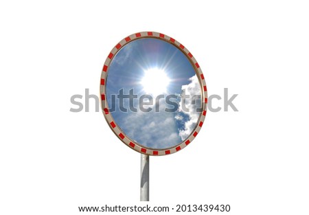 View of the sky with sun in a road safety convex mirror on an isolated white background