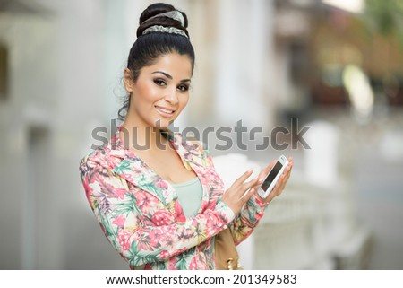 Happy woman talking phone. Beautiful girl taken pictures of her self. selfie photo.  attractive female portrait outdoors. soft tonality. series