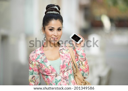 Happy woman talking phone. Beautiful girl taken pictures of her self. selfie photo.  attractive female portrait outdoors. soft tonality. series.