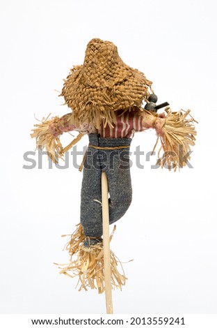 scarecrow doll on white background