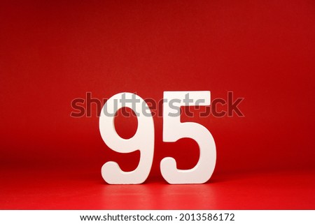 Ninety Five ( 95 ) white number wooden on Red Background with Copy Space - New promotion 95% Percentage , Birthday anniversary , Business finance Concept 