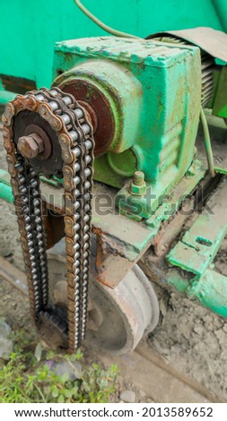 chain on a motor-driven sliding gate system, close-up photo