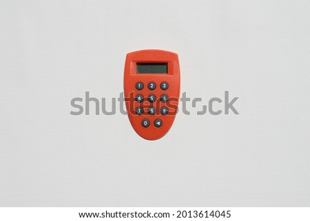 Bank token is a tool for internet banking transactions. Orange color bank token on a white background. 
