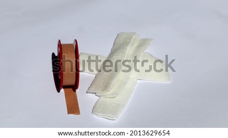 gauze and wound plaster on a white background
					