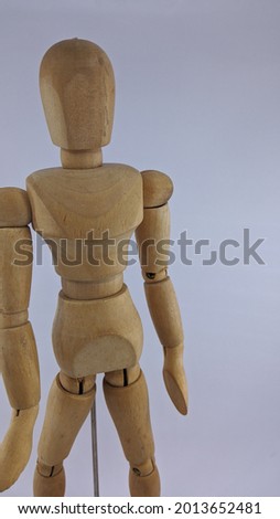 small mannequin made of wood for comic illustration making reference