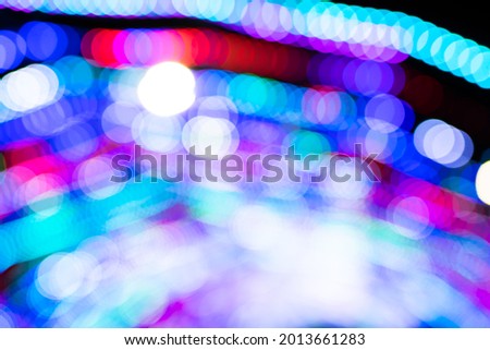 Colorful blurred bokeh of city lights at night. Defocus of lighting at night.