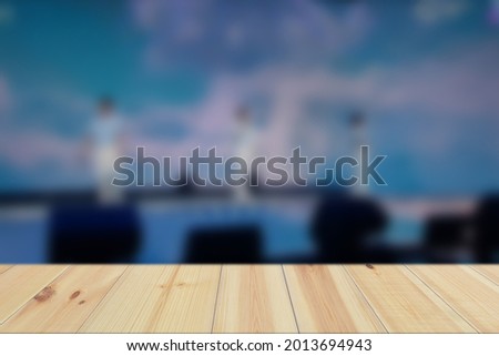 Empty Wood Plate Top Table On Concert Crowd Attending A Concert