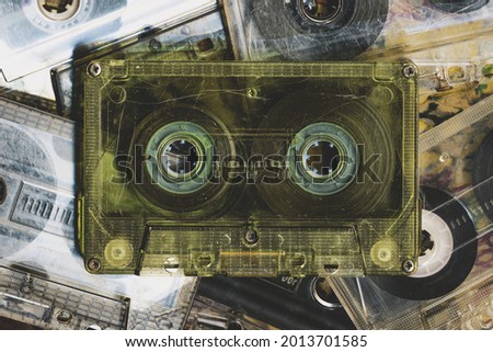 Vintage audio tapes placed next to each other.Top view on vintage media devices, copy space on labels, flat lay. 80s retro music background.  