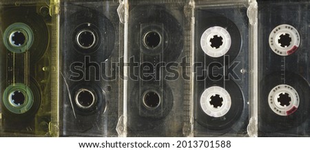 Set old audio cassette tapes collection.Obsolete technology of audio recording and playback format audio cassette tapes ,top view.Vintage media devices. 80s retro music background.  