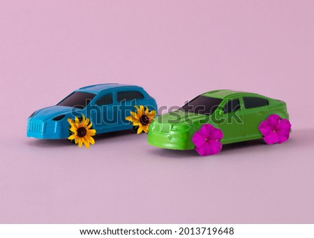 Cars that have flowers on their wheels.