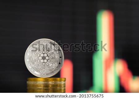 ADA crypto coin front of it's exchange rate. Royalty-Free Stock Photo #2013755675