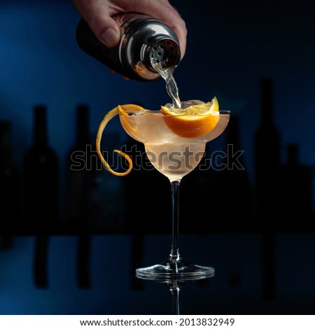 Cocktail Great Gatsby on a black reflective background. Royalty-Free Stock Photo #2013832949