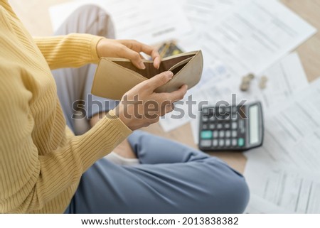 Stressed, Problem business person woman holding and open empty wallet, purse no have money for bill payment, credit card loan or expense. Bankruptcy, bankrupt or debt financial, mortgage concept. Royalty-Free Stock Photo #2013838382