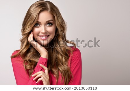 Woman surprise showing product .Beautiful girl  pointing to the side . Presenting your product. Expressive facial expressions emotions  businesswoman