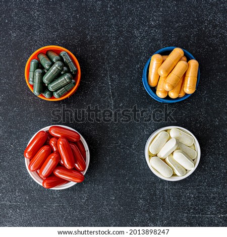 multivitamin dietary supplements  top view. mental wellbeing and personal health concept Royalty-Free Stock Photo #2013898247