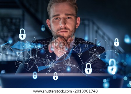 Portrait of handsome businessman thinking how to protect clients confidential information and cyber security. IT hologram padlock icons over office background. Hand on chin