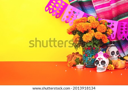 Day of the dead, Dia De Los Muertos Celebration Background With sugar Skull, calaverita, marigolds or cempasuchil flowers, bread of death or Pan de Muerto with Copy Space. Traditional Mexican culture  Royalty-Free Stock Photo #2013918134