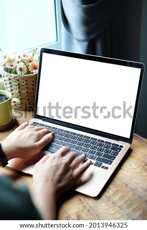 Mock up Copy Space Blank Screen workspace with computer laptop on table.	 Royalty-Free Stock Photo #2013946325