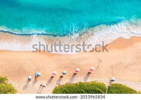 Aerial drone top view crowd of happy people relax at tropical Beach with sunset in Phuket, Thailand, Beautiful Phuket beach is famous tourist destination at Andaman sea. Holiday summer concept Royalty-Free Stock Photo #2013965834