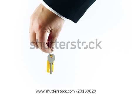 Hand with key  with blank tag on white background. Isolated object.
